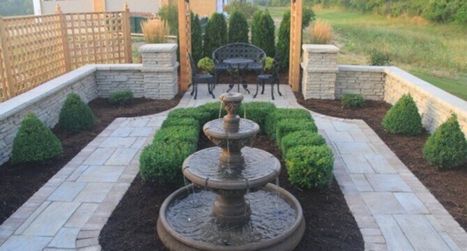 A Serene Garden With a Charming Fountain